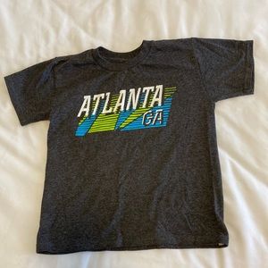 Atl Ga boys tshirt size not on shirt. But it fits like a boys small.